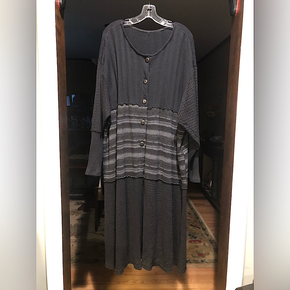 Beautiful knit topper coat with unique patterns. Lots of style.